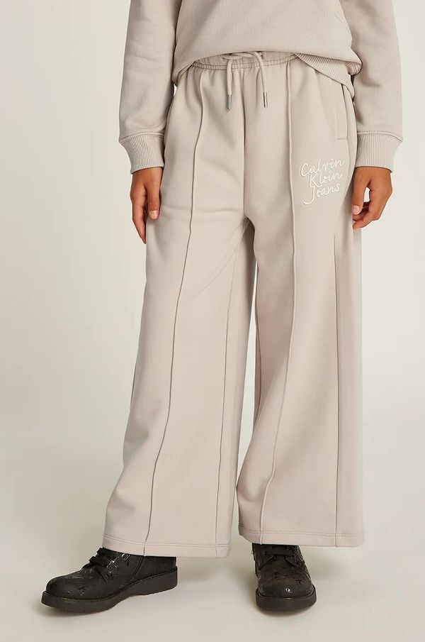 Calvin Klein Jeans Dječji donji dio trenirke Calvin Klein Jeans HANDW LOGO WIDE boja: bež, bez uzorka, IG0IG02775
