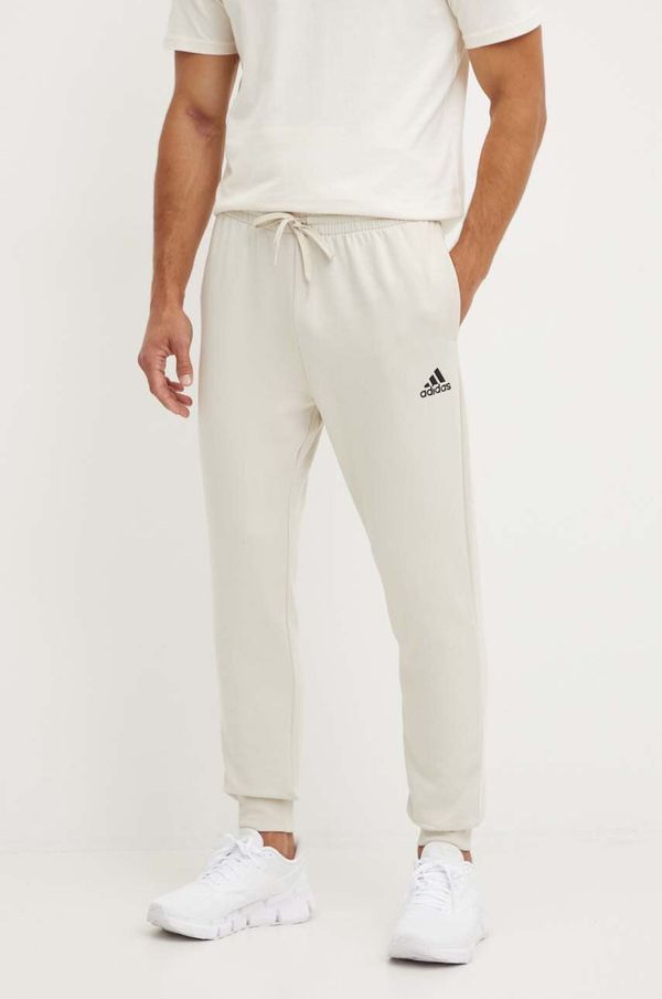 adidas Donji dio trenirke adidas Essentials boja: bež, bez uzorka, JH1039