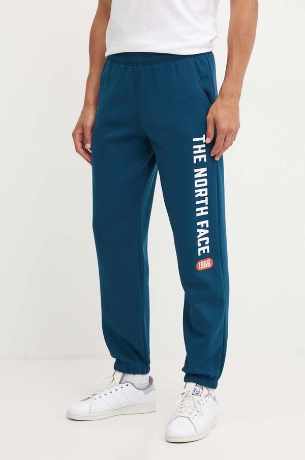 The North Face Donji dio trenirke The North Face Pant Varsity Graphic boja: tirkizna, s tiskom, NF0A89DP1NO1