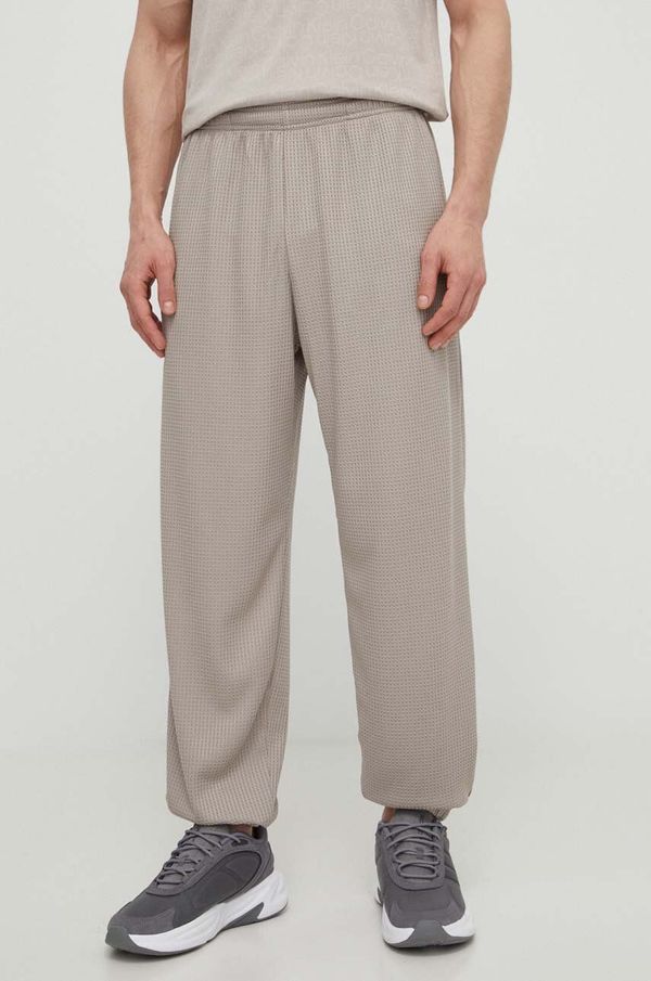 Under Armour Donji dio trenirke Under Armour boja: bež, bez uzorka