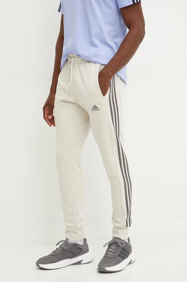 adidas Pamučni donji dio trenirke adidas Essentials boja: bež, s uzorkom, IW7682
