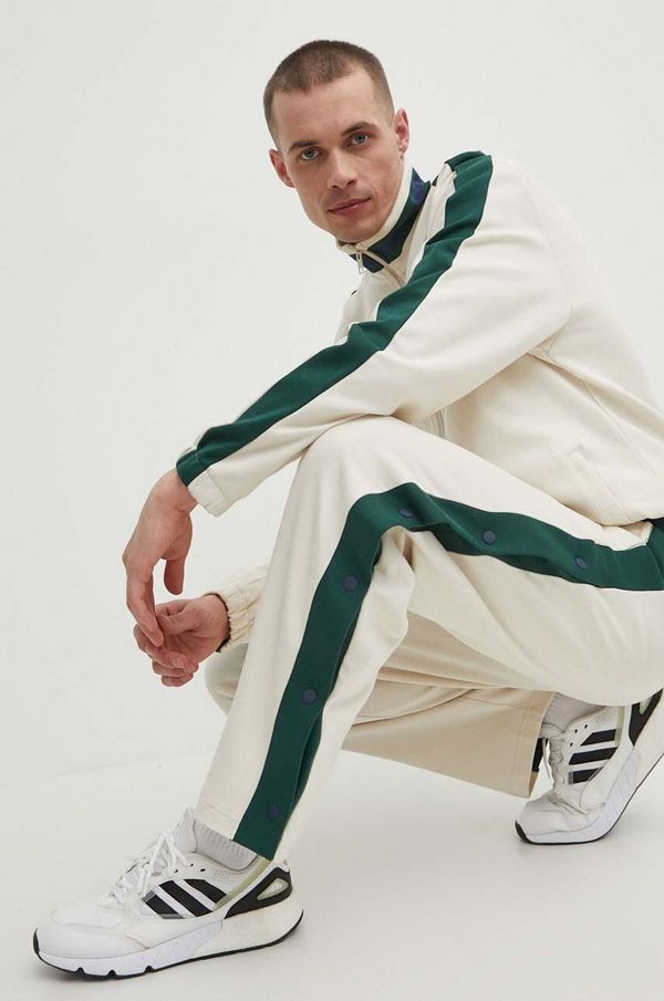 New Balance Pamučni donji dio trenirke New Balance boja: bež, s uzorkom, MP41504LIN