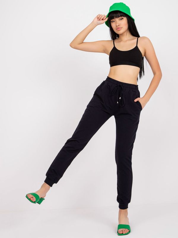 Fashionhunters Basic dark blue sweatpants with tie