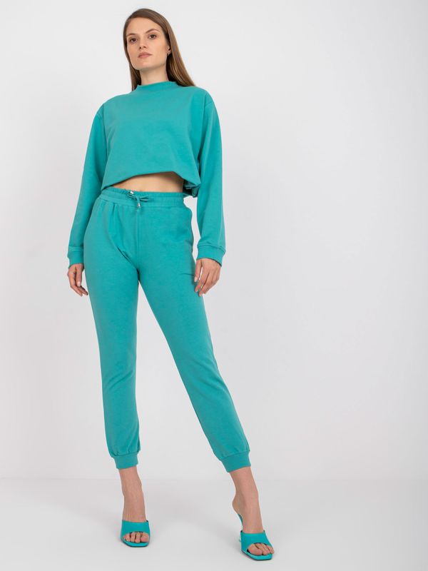 Fashionhunters Basic dusty green sweatpants with tying detail