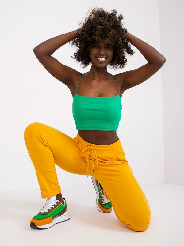 Fashionhunters Basic light orange sweatpants with pockets