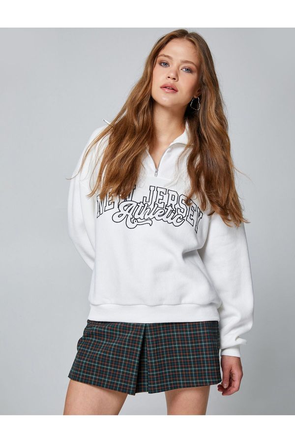 Koton Koton Half-Zip Sweatershirt with Embroidered Standing Collar Long Sleeves.