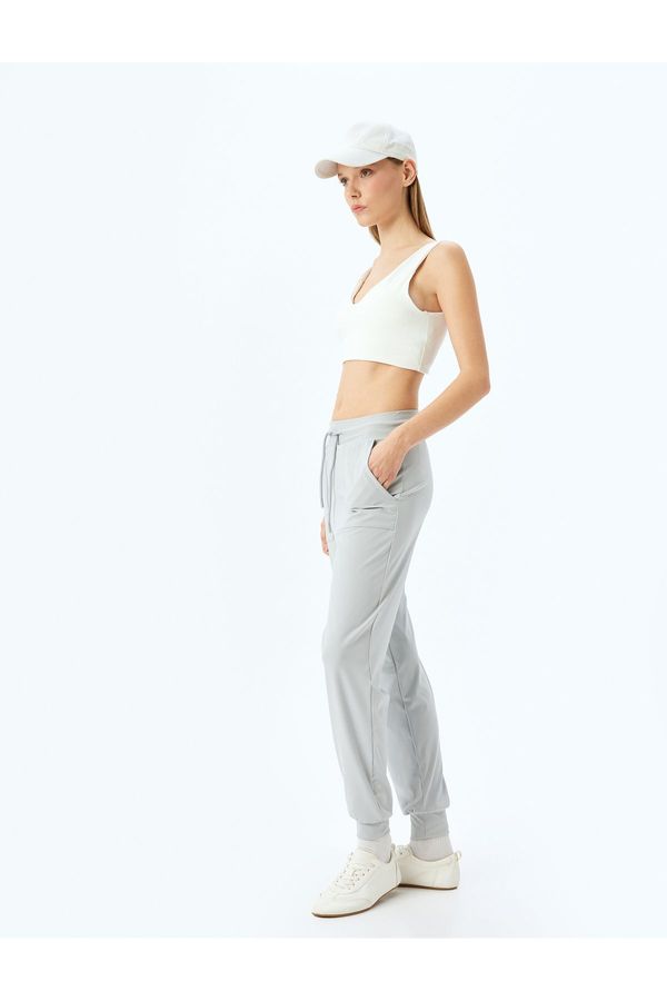 Koton Koton Low Waist Seam Detail Pocketed Waist Tied Jogger Sweatpants