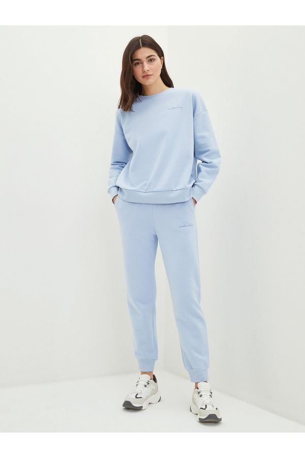 LC Waikiki LC Waikiki Ženski tekst tiskao joggers trenirke s elastičnim strukom.