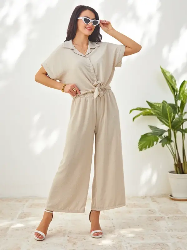 Resti Resti Women's set with a tied short-sleeve shirt and flared pants with rhinestones