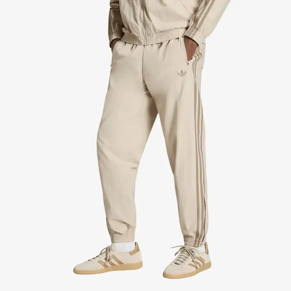 adidas Originals Donji dio trenerke adidas Firebird Woven Pants UNISEX Khaki Three M
