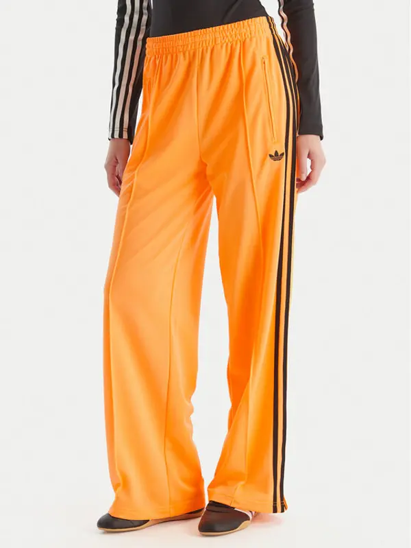 Adidas adidas Donji dio trenerke adicolor Classic Firebird JY2694 Žuta Loose Fit