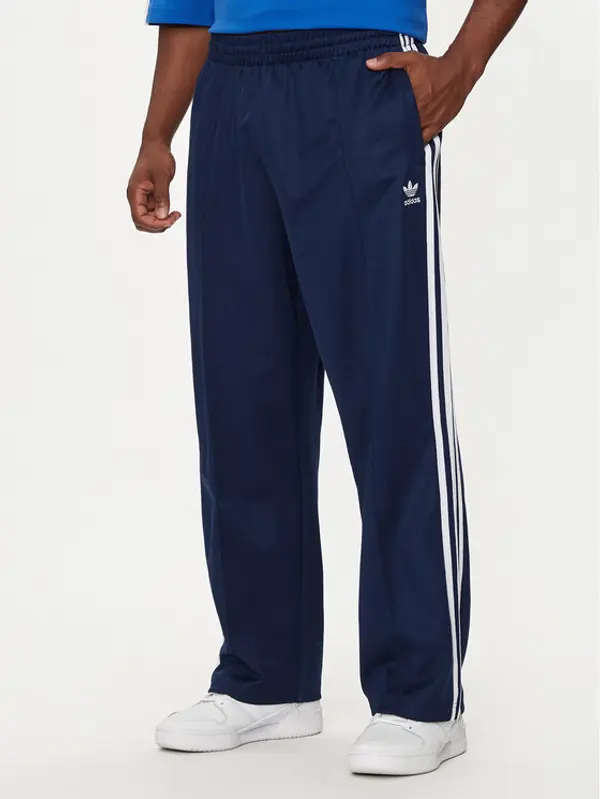 Adidas adidas Donji dio trenerke adicolor Firebird IZ2466 Tamnoplava Baggy Fit