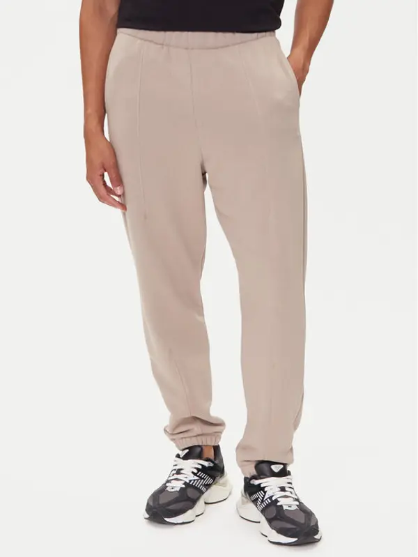 On On Donji dio trenerke Club Pants 1ME1004 Bež Relaxed Fit