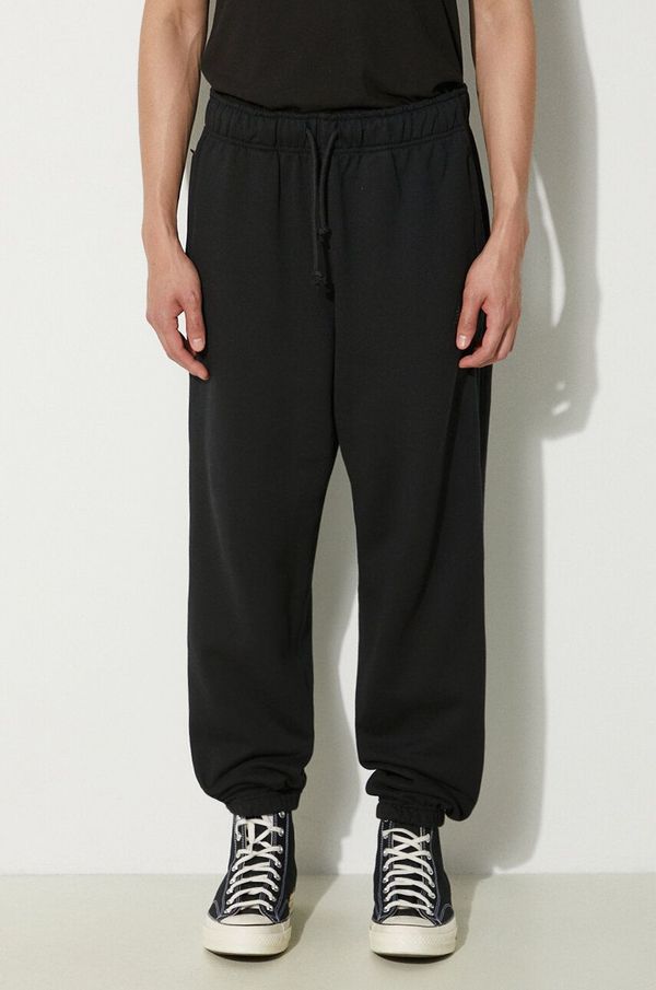 New Balance Pamučni donji dio trenirke New Balance boja: crna, bez uzorka, MP41508BK