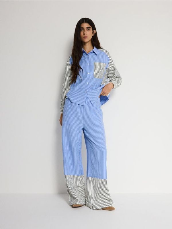 Reserved Reserved - Hlače s kontrastnim umetkom - šaren