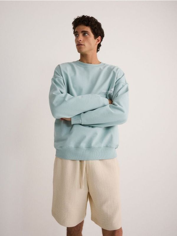 Reserved Reserved - Jogger kratke hlače od muslina - bež