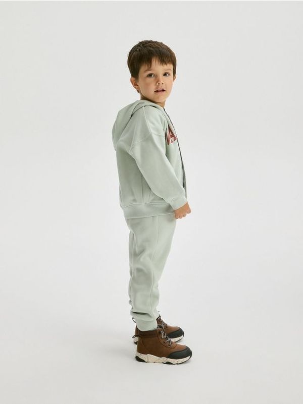 Reserved Reserved - Pamučni komplet sportskih hlača i majice - bljedozeleno