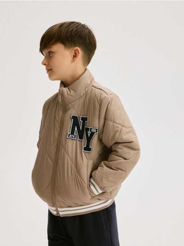 Reserved Reserved - Prošivena bomber jakna - bež